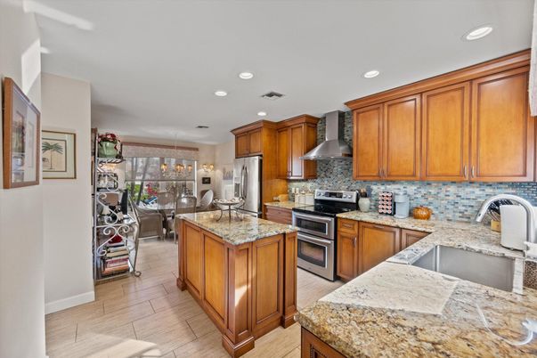 Chandelier, Dining room, Interior, Kitchen, Pendant Lights, Recessed Lighting, Stainless Steel Appliances, Wood Texture Flooring