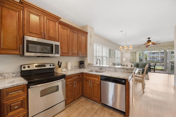 Chandelier, Dining room, Interior, Kitchen, Stainless Steel Appliances, Wood Texture Flooring
