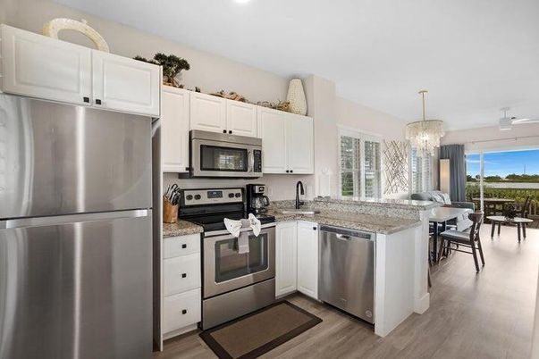 Chandelier, Dining room, Interior, Kitchen, Recessed Lighting, Stainless Steel Appliances, Wood Texture Flooring