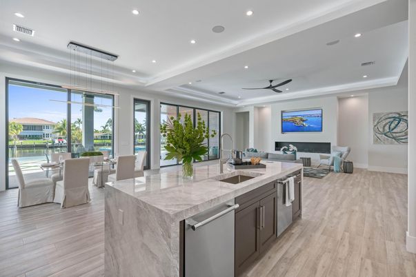 Dining room, Interior, Kitchen, Living room, Pendant Lights, Recessed Lighting, Stainless Steel Appliances, Water, Wood Texture Flooring