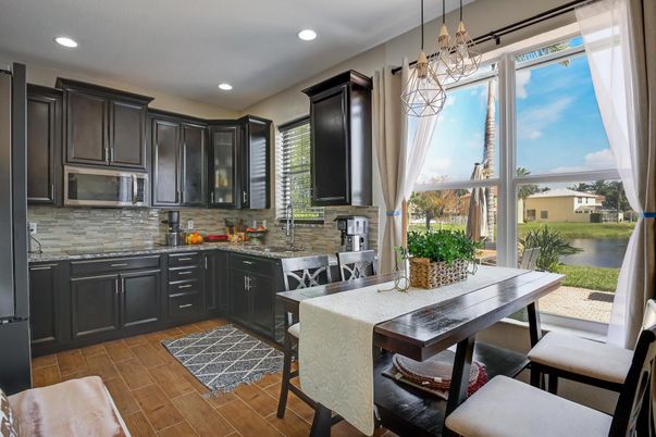 Chandelier, Dining room, Interior, Kitchen, Pendant Lights, Recessed Lighting, Water, Wood Texture Flooring