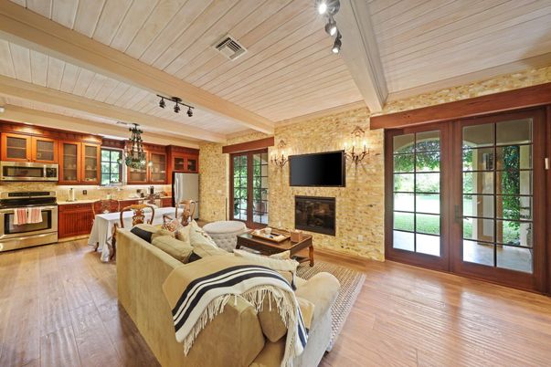 Chandelier, Dining room, Fireplace, Interior, Kitchen, Living room, Stainless Steel Appliances, Stone Walls, Wood Texture Flooring