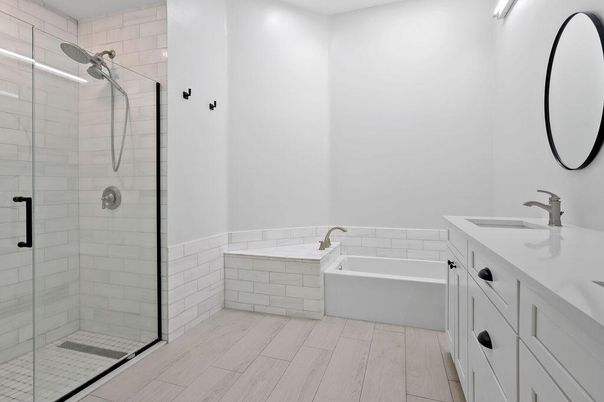 Bathroom, Dual Sink Vanities, Glass Shower, Interior, Recessed Lighting, Wood Texture Flooring