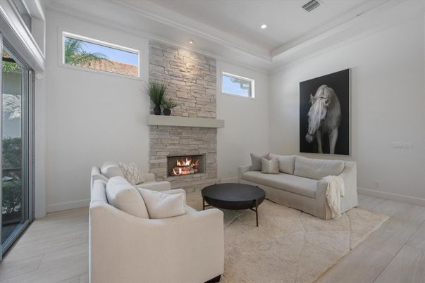 Fireplace, Interior, Living room, Recessed Lighting, Stone Walls, Wood Texture Flooring