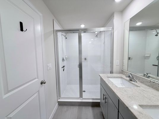 Bathroom, Dual Sink Vanities, Glass Shower, Interior, Recessed Lighting, Wood Texture Flooring
