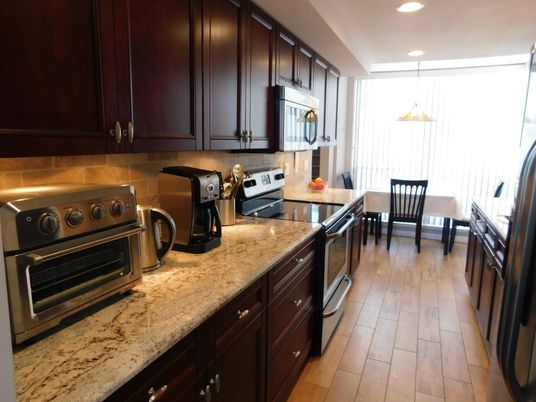 Dining room, Interior, Kitchen, Pendant Lights, Recessed Lighting, Stainless Steel Appliances, Wood Texture Flooring
