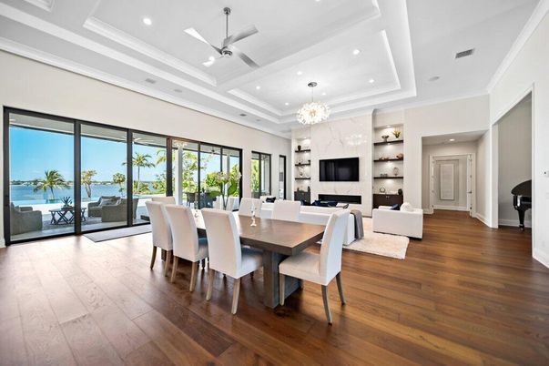 Dining room, Fireplace, Interior, Living room, Recessed Lighting, Water, Wood Texture Flooring