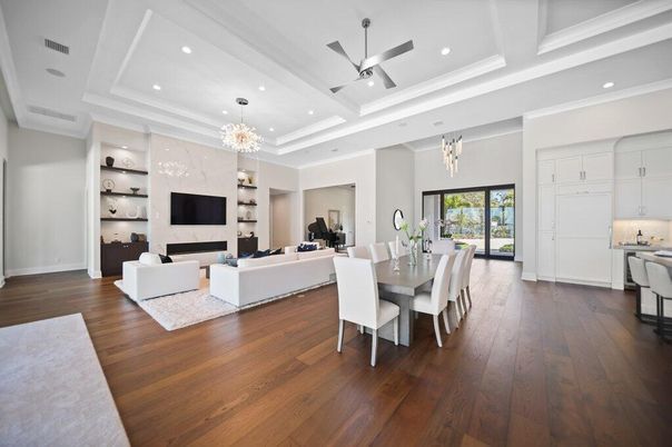 Chandelier, Dining room, Fireplace, Interior, Living room, Pendant Lights, Recessed Lighting, Wood Texture Flooring