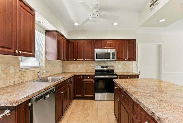Interior, Kitchen, Recessed Lighting, Stainless Steel Appliances, Wood Texture Flooring