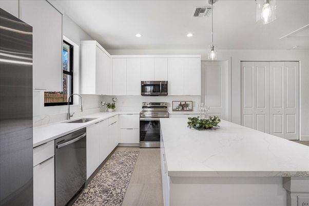 Interior, Kitchen, Pendant Lights, Recessed Lighting, Stainless Steel Appliances, Wood Texture Flooring