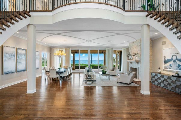 Chandelier, Dining room, Fireplace, Interior, Living room, Recessed Lighting, Water, Wood Texture Flooring