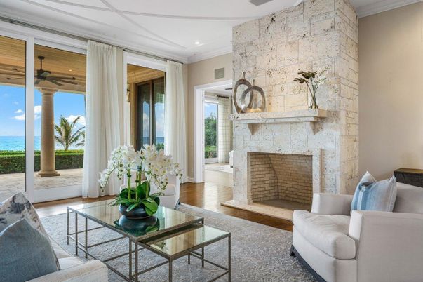 Fireplace, Interior, Living room, Recessed Lighting, Stone Walls, Water, Wood Texture Flooring