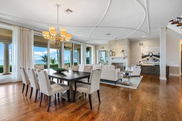 Chandelier, Dining room, Fireplace, Interior, Living room, Recessed Lighting, Stone Walls, Water, Wood Texture Flooring
