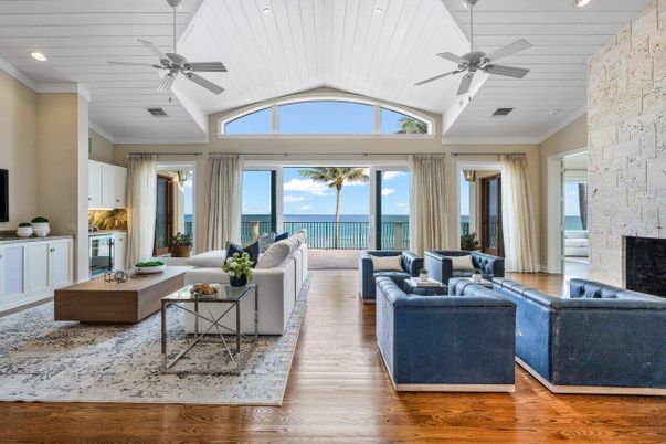 Fireplace, Interior, Living room, Recessed Lighting, Stone Walls, Water, Wood Texture Flooring