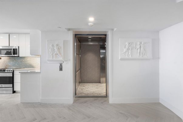 Elevator, Interior, Kitchen, Recessed Lighting, Stainless Steel Appliances, Wood Texture Flooring