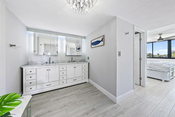 Bathroom, Chandelier, Dual Sink Vanities, Interior, Wood Texture Flooring