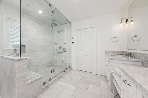 Bathroom, Dual Sink Vanities, Glass Shower, Interior, Marble, Marble Walls, Recessed Lighting