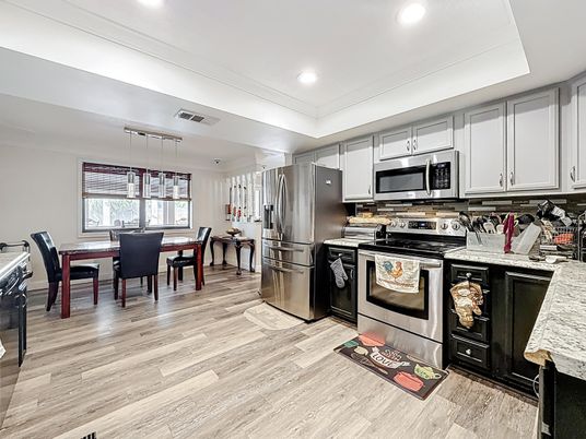 Dining room, Interior, Kitchen, Pendant Lights, Recessed Lighting, Stainless Steel Appliances, Wood Texture Flooring