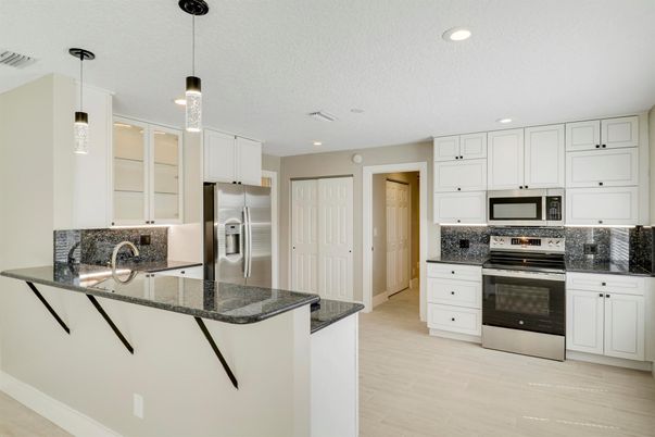 Interior, Kitchen, Pendant Lights, Recessed Lighting, Stainless Steel Appliances, Wood Texture Flooring