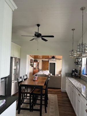 Chandelier, Dining room, Interior, Kitchen, Living room, Pendant Lights, Stainless Steel Appliances, Wood Texture Flooring