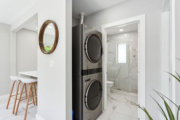 Bathroom, Glass Shower, Interior, Marble, Marble Walls, Recessed Lighting, Utility Closets, Washer