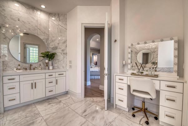 Bathroom, Dual Sink Vanities, Interior, Marble, Marble Walls, Recessed Lighting, Wood Texture Flooring