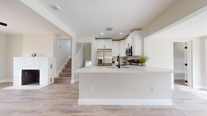 Fireplace, Interior, Kitchen, Recessed Lighting, Stainless Steel Appliances, Wood Texture Flooring