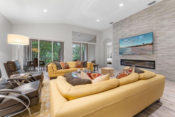 Dining room, Fireplace, Interior, Living room, Recessed Lighting, Stone Walls, Wood Texture Flooring