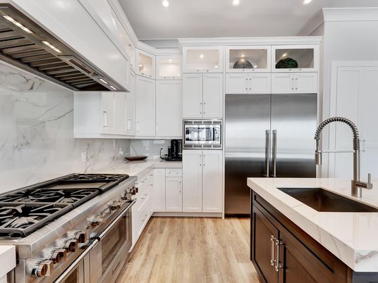 Interior, Kitchen, Marble Walls, Recessed Lighting, Stainless Steel Appliances, Wood Texture Flooring