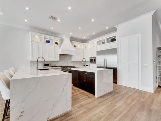 Interior, Kitchen, Marble Walls, Recessed Lighting, Stainless Steel Appliances, Wood Texture Flooring