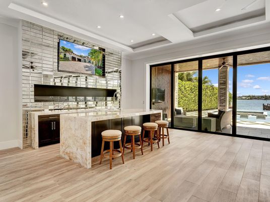 Fireplace, Interior, Recessed Lighting, Stone Walls, Water, Wood Texture Flooring