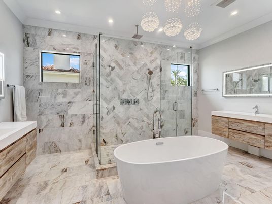 Bathroom, Free Standing Baths, Glass Shower, Interior, Marble, Marble Walls, Pendant Lights, Recessed Lighting