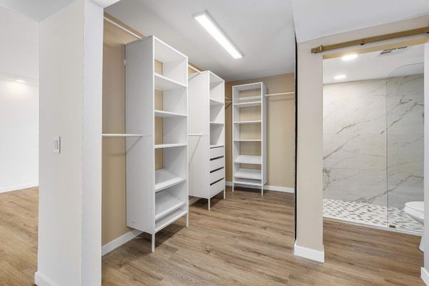 Bathroom, Interior, Marble Walls, Recessed Lighting, Walk-in Closets, Wood Texture Flooring