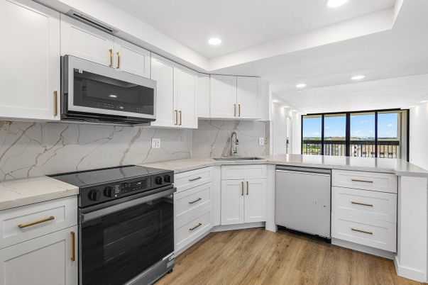 Interior, Kitchen, Marble Walls, Recessed Lighting, Stainless Steel Appliances, Wood Texture Flooring