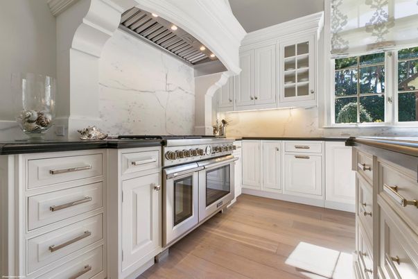 Interior, Kitchen, Marble Walls, Recessed Lighting, Stainless Steel Appliances, Wood Texture Flooring
