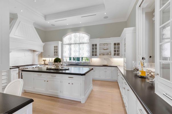 Interior, Kitchen, Marble Walls, Recessed Lighting, Stainless Steel Appliances, Wood Texture Flooring