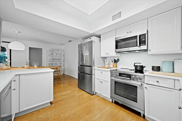 Dining room, Interior, Kitchen, Pendant Lights, Stainless Steel Appliances, Wood Texture Flooring