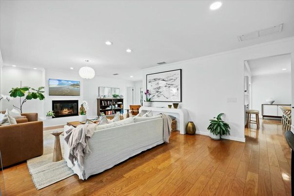 Chandelier, Fireplace, Interior, Living room, Pendant Lights, Recessed Lighting, Wood Texture Flooring