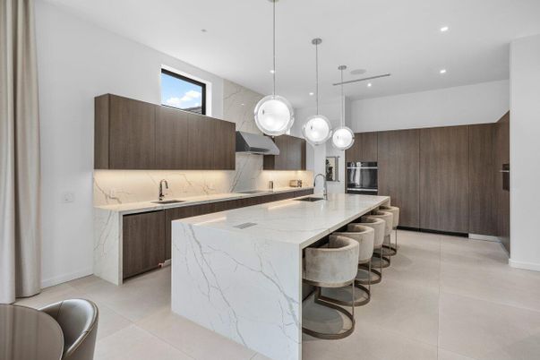 Interior, Kitchen, Marble Walls, Pendant Lights, Recessed Lighting, Stainless Steel Appliances