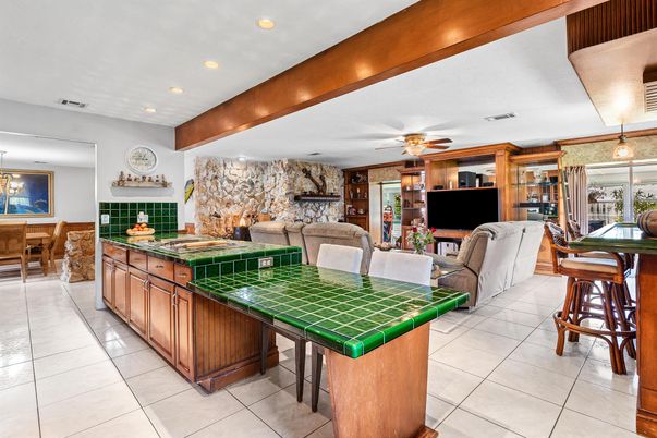Fireplace, Interior, Kitchen, Living room, Recessed Lighting, Stone Walls, Tile Countertops