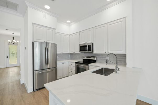 Chandelier, Interior, Kitchen, Recessed Lighting, Stainless Steel Appliances, Wood Texture Flooring