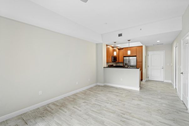 Empty room, Interior, Kitchen, Pendant Lights, Recessed Lighting, Stainless Steel Appliances, Wood Texture Flooring