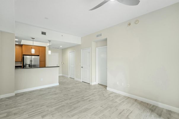 Empty room, Interior, Kitchen, Pendant Lights, Recessed Lighting, Stainless Steel Appliances, Wood Texture Flooring
