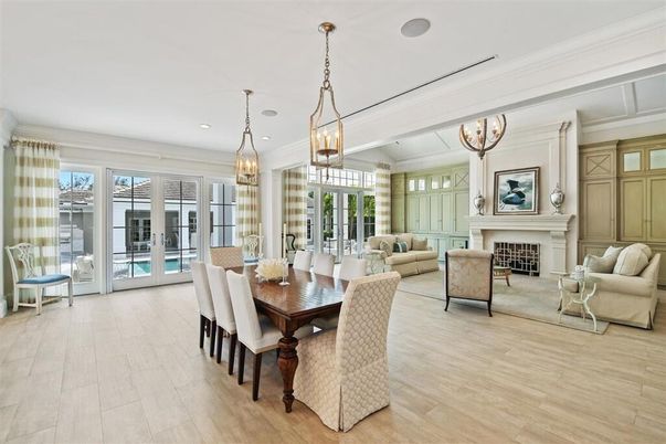 Chandelier, Dining room, Fireplace, Interior, Living room, Pendant Lights, Recessed Lighting, Wood Texture Flooring