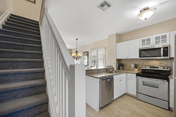 Chandelier, Interior, Kitchen, Pendant Lights, Stainless Steel Appliances, Wood Texture Flooring