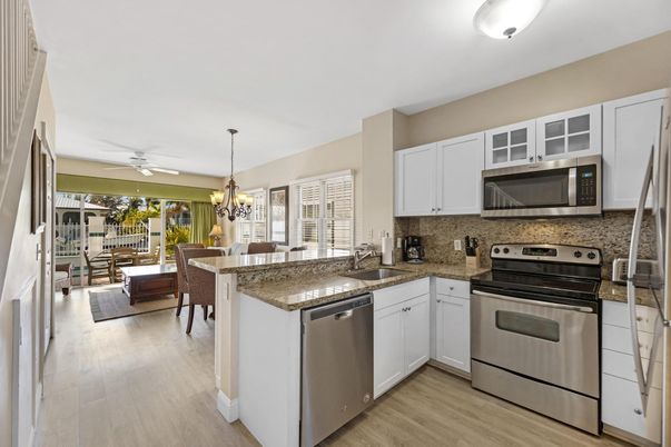 Chandelier, Dining room, Interior, Kitchen, Stainless Steel Appliances, Wood Texture Flooring