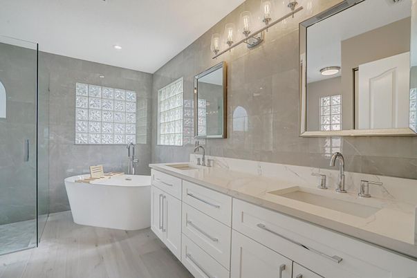 Bathroom, Dual Sink Vanities, Free Standing Baths, Glass Shower, Interior, Recessed Lighting, Wood Texture Flooring