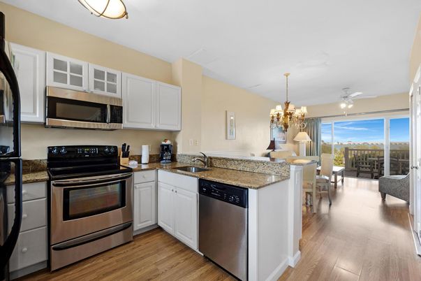 Chandelier, Dining room, Interior, Kitchen, Stainless Steel Appliances, Wood Texture Flooring