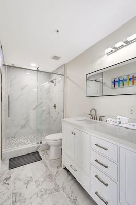 Bathroom, Dual Sink Vanities, Glass Shower, Interior, Marble, Marble Walls, Recessed Lighting