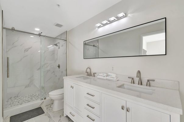 Bathroom, Dual Sink Vanities, Glass Shower, Interior, Marble, Marble Walls, Recessed Lighting